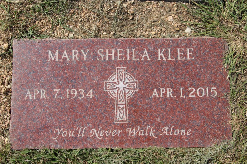 Memorial monument among wildflowers